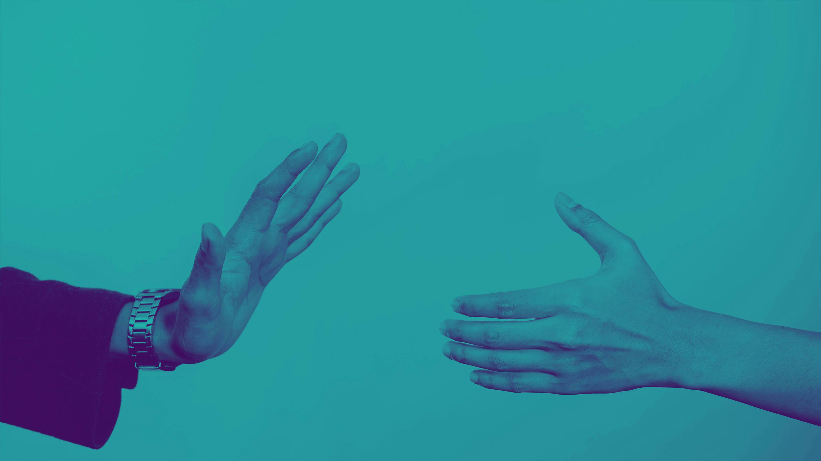 Stylized image of two hands, one reaching out for a handshake and the other refusing.